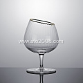 Gold rimmed red wine glasses